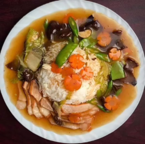 rice, cabbage, carrot, mushroom, broccoli and brown sauce ,fried egg with protein.